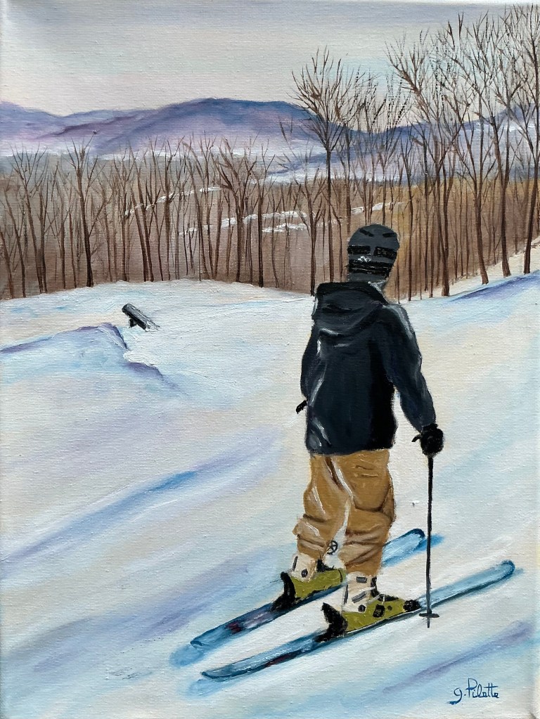 Garçon en ski alpin regardant au loin avant d’effectuer un saut 